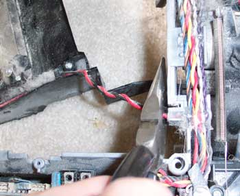 Clip the vacuum motor
wires