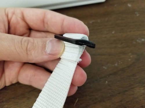 Slide attached to shoulder strap